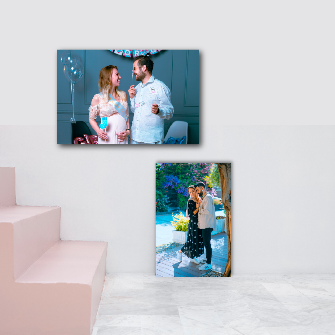 A cozy couple lounges on a couch, surrounded by personalized art and wall decor ideas for their home.