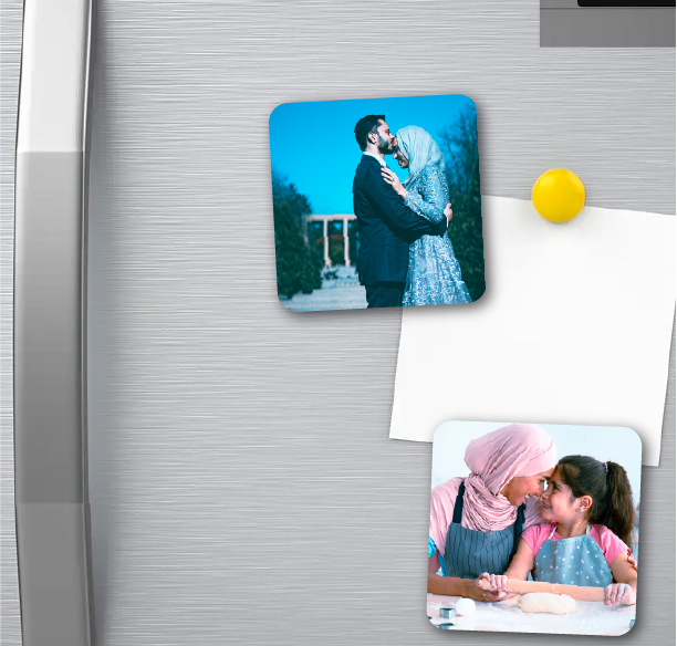 A family-themed refrigerator adorned with photo magnets, showcasing cherished memories as wall decor in a home