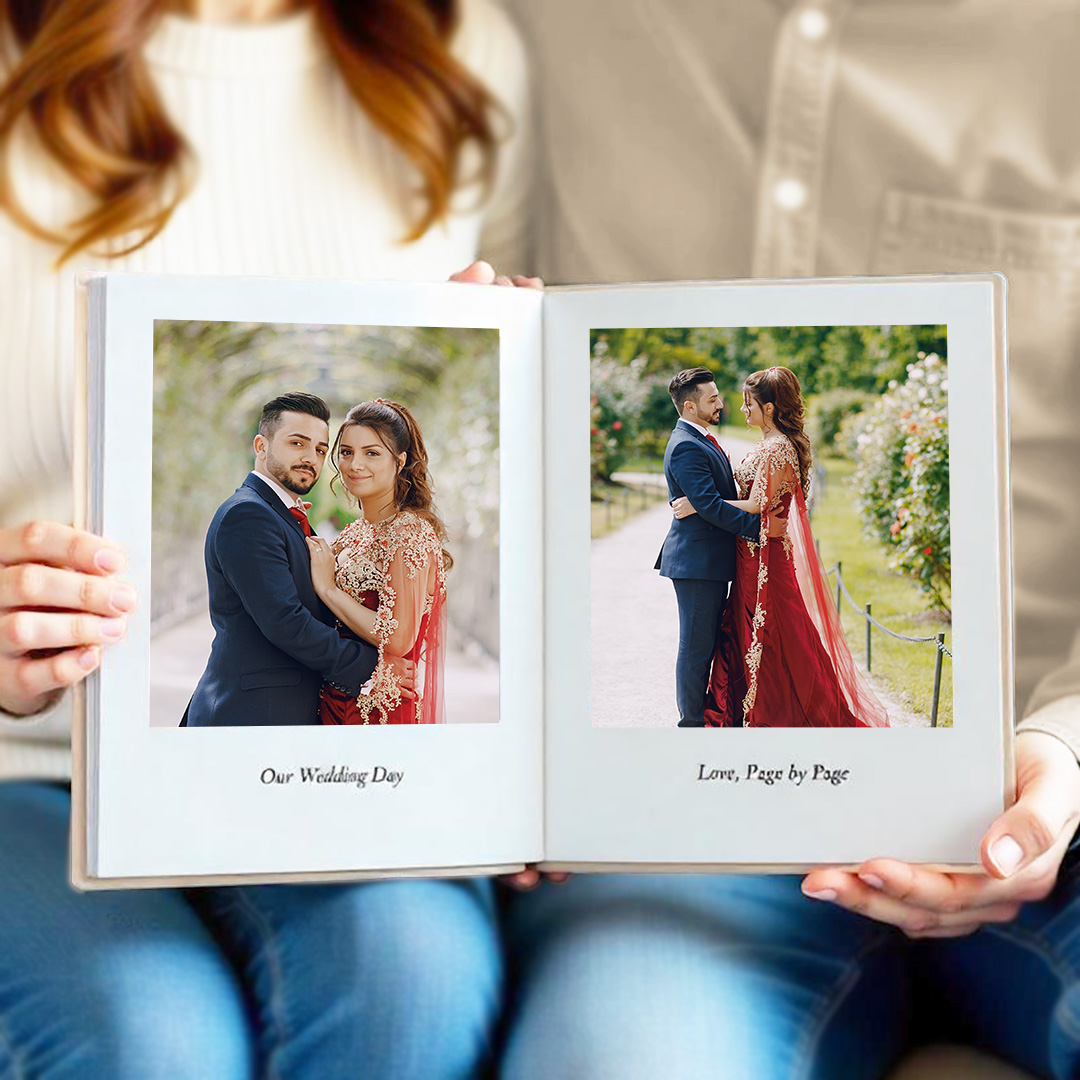 Couple flipping through UAE travel photo album on holiday