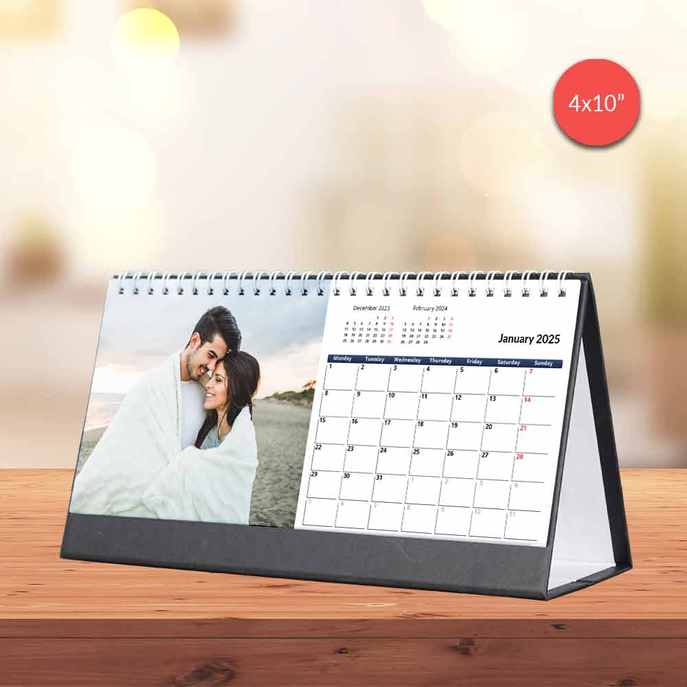 Personalized desk calendar featuring wedding photos, placed on a modern desk in a bright office with a UAE city view