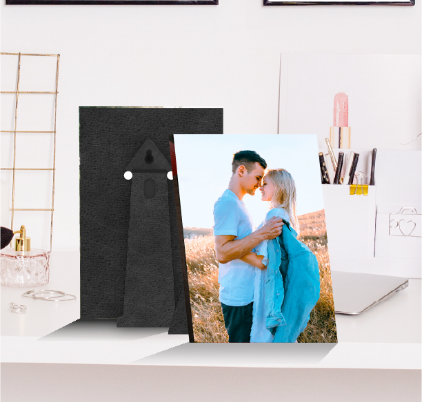 Personalized table photo frame displaying a couple’s wedding photo, elegantly placed on a modern table in a UAE living room
