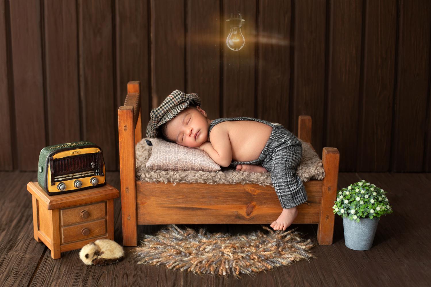 Baby vintage-themed photoshoot with neutral backdrop and props